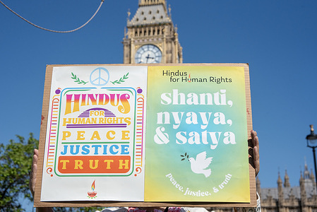 A protester holds a placard during the demonstration. People gathered from the Indian and Pakistani diasporas on the Parliament Square to protest against the war between India and Pakistan.
