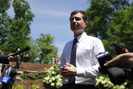 South Bend Mayor Pete Buttigieg, who is running for the Democratic nomination for President of the United States answers question during a press gaggle after delivering an hour long speech on foreign policy and security at the Indiana University Auditorium in Bloomington.