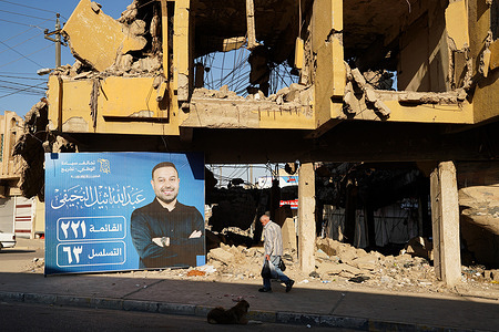 A man walks past a banner of the candidate Abdullah al-Nujaifi placed in front of war damaged building depicting political candidate, competing for a seat in the Iraqi Council of Representatives, days before the Parliamentary elections, in Old Mosul. Parliamentary elections are scheduled to be held in Iraq on 11 November 2025, which will determine the 329 members of Iraq's Council of Representatives, who are responsible for electing the country's president and approving the appointment of the prime minister.