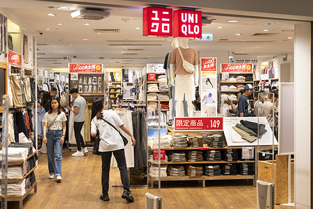 Shoppers are seen at the Japanese clothing brand Uniqlo store in Hong Kong.