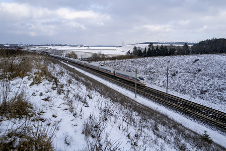 A train crosses the Bavarian countryside as cold weather with heavy snow in places continues to dominate. For some travelers travelling by train may be the better option this week due to the winter weather The forecast warns for black ice and frost in some regions possibly which will make travel difficult, due to slippery roads and poor visibility.
