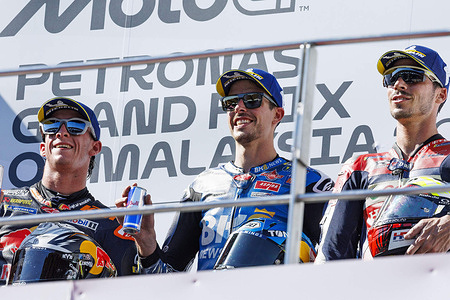 Number 73 Gresini Racing MotoGP rider Alex Marquez, Number 37 Red Bull KTM Factory Racing rider Pedro Acosta and Number 36 Honda Team rider Joan Mir celebrate being on the podium after the race at the 2025 Petronas Grand Prix of Malaysia.