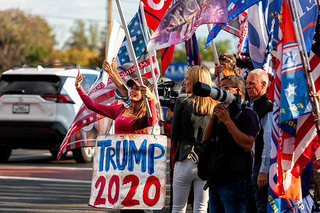 Trump supporters gather outside Walter Reed National Military Medical Center, where Trump is hospitalized after being infected with Covid-19. They came to show their support during the four days he spent in the hospital after contracting the novel coronavirus.