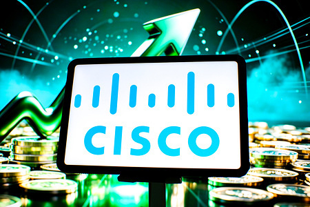 In this photo illustration, the Cisco logo is seen displayed on a tablet screen.