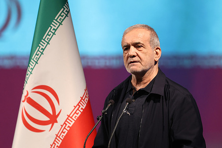 Iranian President Masoud Pezeshkian delivers a speech during a ceremony commemorating former Supreme Leader Ali Khamenei in Tehran.