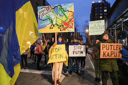 People gather near the Permanent Mission of the Russian Federation to protest against the Russian invasion of Ukraine. Russia's President Vladimir Putin began a large-scale attack in Ukraine overnight.