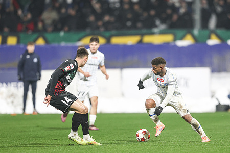 Kasjan Lipkowski of GKS Tychy (L) and Jonathan Junior of Stal Rzeszow (R) seen in action during BETCLIC 1 POLISH LEAGUE 2025/2026 football match between Stal Rzeszow and GKS Tychy at Municipal Stadium (Rzeszow). Final score Stal Rzeszow 2 : 1 GKS Tychy.