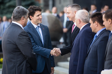 Prime Minister of Canada Justin Trudeau shake hands with one of the guests during his meeting with the Ukrainian President Petro Poroshenko in Kiev.