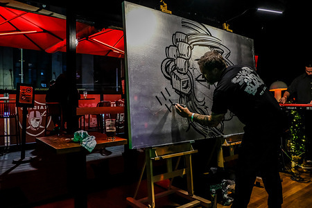 Australian graffiti artist Russell Fenn better known as Sofles seen during a live graffiti art session at The Joint venue for a "Silver and Black" event in collaboration with NFL Las Vegas Raiders fan club.