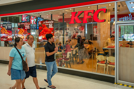 People seen passing by a KFC restaurant in Lotus's Bangkapi shopping mall.