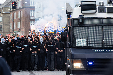 Malmö FF supporters marching to the stadium ahead of the UEFA Champions League 2025/26 third qualifying round second leg match between F.C. Copenhagen and Malmö FF at Parken Stadium. 