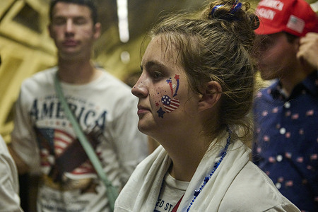 A young lady with American flag face painting celebrates the US' 250th anniversary on the National Mall in Washington DC.