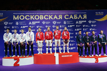 Men's team Competition participants pose during the medal ceremony for Moscow Sabre 2026 at the Irina Viner-Usmanova Gymnastics Palace. Moscow Sabre International Fencing Competition is held in memory of two-time Olympic champion Mikhail Burtsev and brings together over 200 athletes from Russia, Belarus and Azerbaijan. 
Olga Nikitina (Olympic, world and European champion) won the women’s individual competition and Pavel Graudyn (bronze medalist at 2025 European Championships) won the men’s one. 
In the women’s team competition the gold medal was won by the 13th-ranked Russian team with Malena Kunasheva, Anfisa Gromova, Anastasia Bazhenova and Svetlana Sheveleva.
Men's team won 2nd-ranked Russian team (Kamil Ibragimov, Dmitriy Danilenko, Oleg Petrovsky and Vasily Shirshov).
