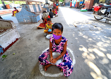 Children sit in a queue with empty plates waiting for the lunch meal distributed by the Police officers during the Coronavirus crisis.
India has so far confirmed 101,156 coronavirus cases, 3,149 deaths and 36,824 recovered.