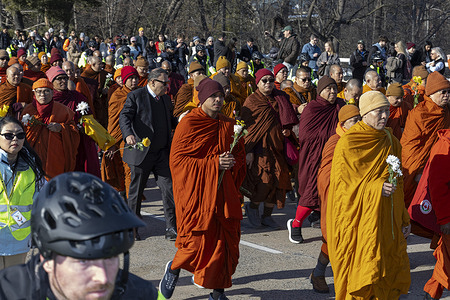 Buddhist monks march along Massachusetts Avenue following an interfaith ceremony at the Washington National Cathedral. The group of 18 monks completed a 2,300-mile march that began on October 26 in Fort Worth, Texas. The “Walk for Peace” aimed to raise awareness of peace, loving-kindness, and compassion in the United States and around the world.