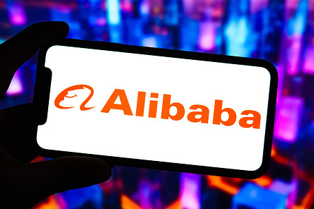 In this photo illustration, the logo of Alibaba is displayed on the screen of a smartphone.