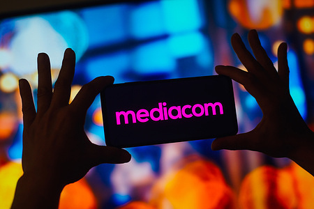 In this photo illustration, the Mediacom Communications Corporation logo is displayed on a smartphone screen.