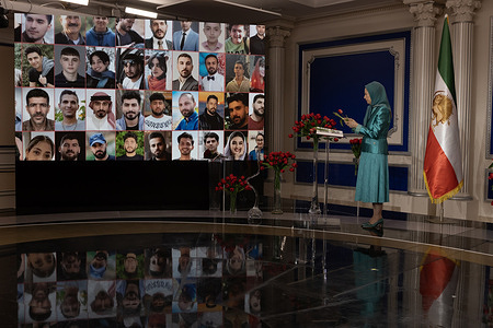 Maryam Rajavi stands beside a display of portraits representing victims of repression in Iran during the Nowruz 1405 ceremony. Iranian expatriates, members of the National Council of Resistance of Iran (NCRI), and families of victims of both the Shah’s regime and the clerical regime gathered for a Persian New Year (Nowruz) ceremony in the presence of Maryam Rajavi, President-elect of the NCRI, marking the beginning of the year 1405. The ceremony highlights calls for the establishment of a democratic republic in Iran based on popular sovereignty, rejecting both monarchical and clerical dictatorship, and emphasizing peace, freedom, justice, gender equality, and a non-nuclear Iran. The event pays tribute to martyrs and political prisoners while underscoring the continued struggle of the Iranian Resistance and reaffirming the NCRI’s Ten-Point Plan as a roadmap toward a free Iran built through the will and vote of its people.