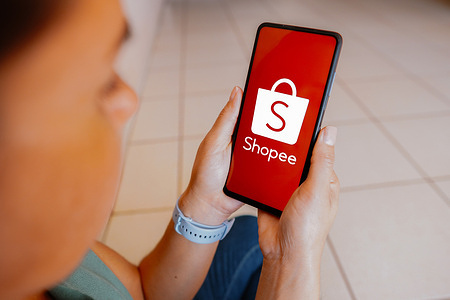 In this photo illustration, the Shopee logo is displayed on a smartphone screen.