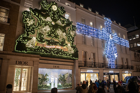 People take photos of the Christmas decorations of the Christian Dior and the Chanel shops in London. British capital, London is very famous around the world about its Christmas lights, markets and iconic buildings. Many buildings are decorated very elegant and Christmassy.