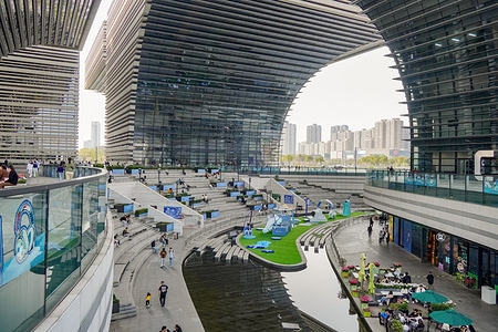 An outdoor scene of Changzhou Culture Plaza, presenting stepped terraces, water features, and people strolling and relaxing in the modern public space with distinctive architectural structures. On April 11, the Jiangsu Football City League ("Su Chao") will kick off at Changzhou Olympic Sports Center in Jiangsu, China. As a well-established high-profile regional football event, it is expected to attract attention nationwide. While gathering for the matches, visitors can experience Changzhou’s modern urban charm, bustling city life and distinctive scenery of Changzhou Culture Plaza.