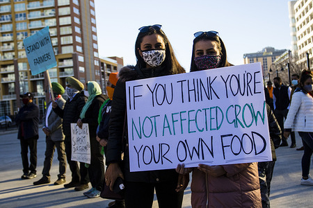 Protesters wearing face masks holds a placard during the demonstration.
Indian community gathered in Nevada to voice their solidarity with farmers in India as part of #standwithindianfarmers efforts.