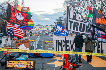 Black Lives Matter activists gather on Black Lives Matter Plaza Northwest during the Martin Luther King Jr. Day. President elect Joe Biden will be inaugurated Wednesday.