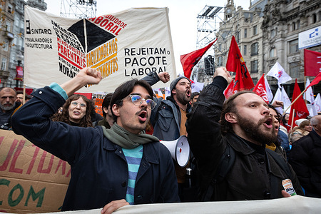 Architecture workers chant slogans during the demonstration. Porto’s Avenida dos Aliados was filled with thousands of demonstrators during Portugal’s national general strike. Called by unions CGTP and UGT, the protest united teachers, architects, cultural workers, and retail employees against proposed labor reforms. Banners denounced precarious contracts, wage stagnation, and threats to parental rights, while satirical signs targeted Prime Minister Luís Montenegro. Volunteers offered food to strikers, highlighting solidarity as diverse sectors demanded dignity, fairness, and stronger protections for workers.