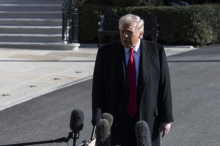 U.S. President Donald Trump speaks with members of the press as he departs the White House. Trump is traveling to Detroit, Michigan, where he is scheduled to visit the Ford River Rouge Complex and speak at the Detroit Economic Club.