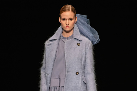 A model walks the runway during a fashion show at Victoria Andreyanova's Fashion House. St. Petersburg Fashion Week is an international professional fashion event of federal significance. The official Fashion Week is held with the support of the Ministry of Industry and Trade of the Russian Federation, the Government of St. Petersburg, and the Fashion Syndicate. The new season of fashion shows will take place from October 26 to 29 at the New Stage of the Alexandrinsky Theater in St. Petersburg.