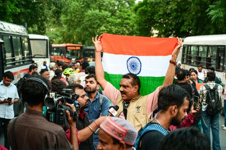 A protester holds the Tricolour and speaks to the media during a protest demanding the resignation of India's Chief Election Commissioner Gyanesh Kumar over alleged voter roll irregularities linked to the Special Intensive Revision (SIR), at Connaught Place. After CJP leaders Ashutosh Ranka and Saurav Das were detained for their attempt to hoist the Tricolour at Jantar Mantar, CJP founder Abhijit Dipke called for hoisting the national flag in protest against their detention and the Election Commission at Central Park in Connaught Place. Delhi Police denied permission for the event, leading to a tense situation.
CJP - Cockroach Janata Party.