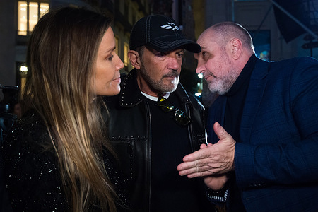 Spanish actor and director Antonio Banderas (C) and his wife Nicole Kimpel (L) are seen speaking with Spanish producer Domingo Merlin (R) as they wait for the switching on of the new Christmas lighting on Marques de Larios street. Every year, Malaga city turns on its Christmas lights to mark the start of Christmas season, where thousands of people gather in downtown city to see a new Christmas decoration and light shows
