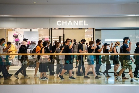 Protesters march through a Chanel store in a shopping mall in Central district during the demonstration.
Pro democracy demonstrators hosted a demonstration in the Pacific Place shopping mall in the Central district of Hong Kong to mark the first anniversary of the start the large scale anti government movement triggered by the proposed extradition bill which many believe will be used as a political tool to silent China's political enemies in Hong Kong.