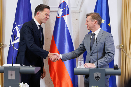 NATO Secretary General Mark Rutte (L) and Slovenian Prime Minister Robert Golob (R) shake hands during a press conference in Brdo pri Kranju. Rutte is paying an official visit to Slovenia as Slovenia hosts the annual session of the NATO Parliamentary Assembly.