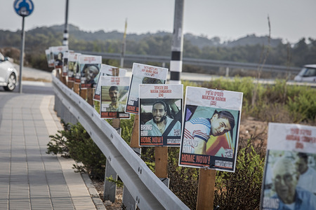 Placards showing Israeli hostages held by Hamas in Gaza are seen on the side of the road. Major highways across Israel were blocked as the families of hostages and missing families forum along with anti-Netanyahu and anti-government groups launched another day of protests demanding action for the Israeli hostages.