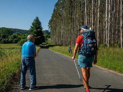 A pilgrim is seen talking with a local. The 872km-long Northern Way, a branch of the Camino de Santiago, starts in Bayonne (France), and follows the northern coastline of Spain into Galicia, where it heads inland towards Santiago de Compostela.