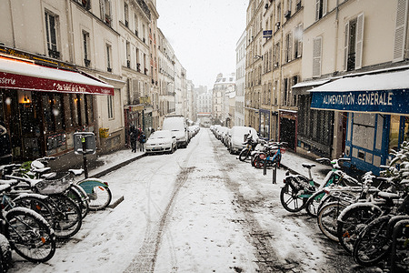 A street is seen covered with snow at the Montmartre neighbourhood, in Paris. A heavy snowstorm hit the French capital, causing much excitement among Parisians and tourists , but also a lot of disruption in transportation on roads. Near the Sacre-Coeur Basilica in the Montmartre neighbourhood, people slid down the hill on the snow.