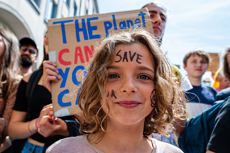A little girl is seen with her face saying, 'Save our planet', during the protest.
Tens of thousands of kids in more of 60 countries went on strike to demand climate change action. #FridaysForFuture is a movement that began in August 2018, after 15 years old Greta Thunberg sat in front of the Swedish parliament every school day for three weeks, to protest against the lack of action on the climate crisis. In Brussels, not just students, but teachers, scientists, and several syndicates took the streets of the Belgian capital for the second time, to protest for better climate policy. According to the Belgian police around 7500 people took the streets of Brussels, in the last climate demonstration before the EU elections.