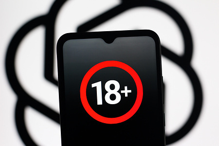 In this photo illustration, the eighteen years or older (18+) symbol is seen displayed on a smartphone screen with the logo of artificial intelligence company OpenAI (ChatGPT) in the background.