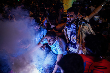 Manchester City fans celebrate in Taksim. Defeating Inter Milan 1-0 at the Atatürk Olympic Stadium during the UEFA Champions League cup match, Manchester City won the champions league cup and the English fans celebrated in Istanbul Taksim Square.