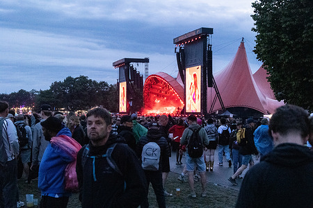 Festival goers seen in front of the Orange Stage at a live concert with the American singer-songwriter and actress Olivia Rodrigo. The festival is the largest of its kind in the Nordics with an expected 130,000 participants during the 7 days the festival spans. The camping area opens four days before the festival. The headline acts include Olivia Rodrigo, Charli XCX, Fontaines D.C. and MØ.
