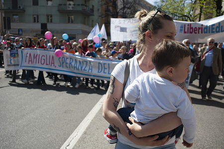 A mother with a child seen during the march.
On the last day of the World Congress of Families, a March for Families took place in Verona. People coming from all Italy joined the event. The World Congresses of Families received critics and comments for the strong anti-abortion and anti-gay positions of its organizers. The right Forza Nuova movement also joined the event.