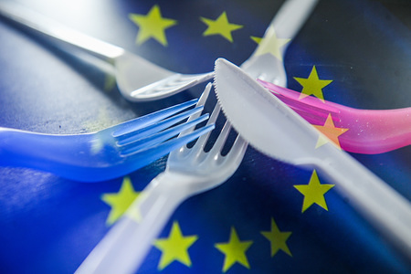 (EDITORS NOTE: This image has been altered: [Double exposure].) A double exposure images shows plastic cutlery with EU flag in this photo illustration. The EU Commission presented a Plastics Strategy on 28 May 2018 to ban single-use products, like plastic utensils, straws, coffee stirrers and cotton swabs, in the fight against plastic waste .