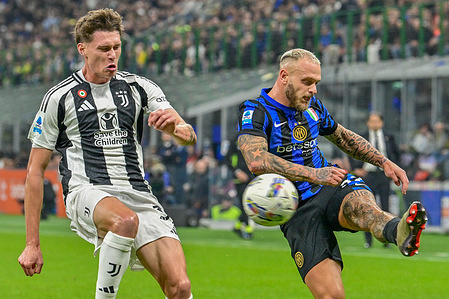 Nicolò Savona of Juventus (L) and Federico Dimarco of Inter (R) seen in action during the Serie A football match 2024/2025, between Inter and Juventus at Giuseppe Meazza Stadium. Final score: Inter 4:4 Juventus.