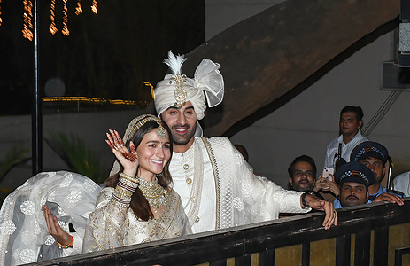 Bollywood actor Ranbir Kapoor and his wife Alia Bhatt pose for a photo call in Mumbai. The couple tied the knot at actor Ranbir Kapoor's home. The wedding ceremony was attended by family members and close friends.