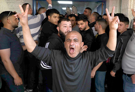 A Palestinian man cries out over the killing of 15-year-old Youssef Sameh as he is taken to Rafidia Hospital in Nablus, West Bank. Palestinian sources said Youssef was killed by Israeli army fire while returning from his school in Beit Wazan, west of Nablus, during an Israeli military operation in the area.