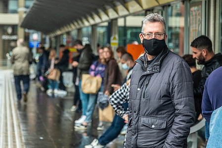 A man wearing a mask as a preventive measure against the spread of covid-19 waits to board a tram.
Masks are still mandatory on Greater Manchester's Public transport as mask laws have now been written into the TFGM by-laws. Transport for Greater Manchester (TFGM) have threatened 200 pound fines for anyone caught without a mask