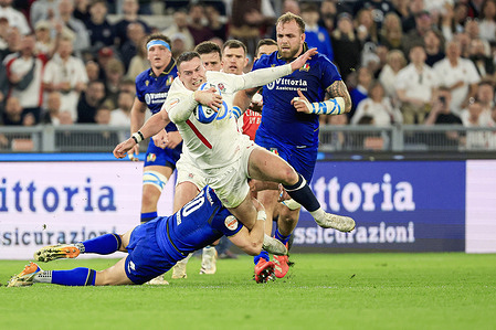 Tom Roebuck of England is tackled by Paolo Garbisi of Italy during the Six Nations Rugby 2026 Italy vs England at Olimpico Stadium . Final score Italy 0:0 England