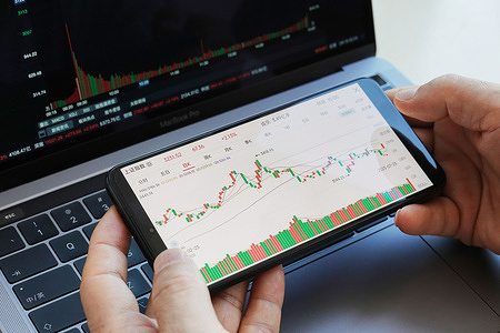 In this photo illustration, data from the Shanghai Composite Index is displayed on the screen of a smartphone.