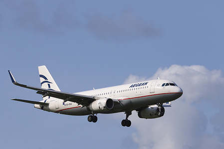 Aegean Airlines Airbus A320-232(WL) seen landing at Amsterdam Schiphol International Airport during a summer day. Aegean Airlines connects Athens to Amsterdam all year around.